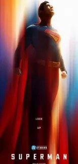 Superhero ascending against a bright light background with flowing cape.