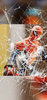 Superhero figure behind cracked glass with vibrant colors.