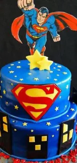 Superhero themed cake with blue icing and red emblem.