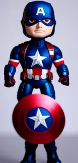 Superhero figure with shield on mobile wallpaper.