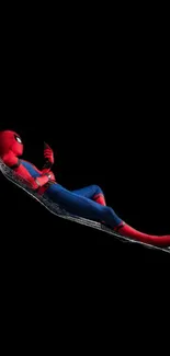 Superhero lounging on web, dynamic wallpaper.