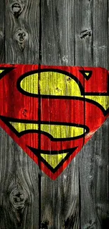 Superman logo on a wood background with red and yellow colors.