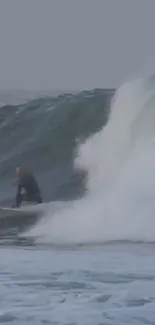 Surfer expertly riding a massive ocean wave with splashing water around.