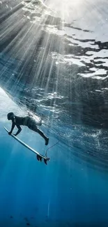 Underwater surfer in sunlit ocean depths, showcasing adventure.