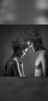 Surreal black and white artwork with tree-like hair on two figures.