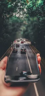 Surreal image of forest road seen through a mobile phone screen.