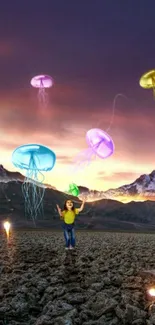 Surreal wallpaper with colorful jellyfish over mountains at dusk.