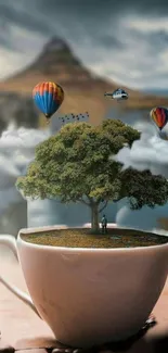 Surreal coffee cup landscape with a tree and hot air balloons.