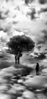 Surreal landscape with tree and person under dramatic clouds in black and white.