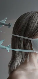 A surreal mobile wallpaper with planes and a mask on a woman's face.