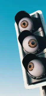 Surreal traffic light with eyes on blue sky background.