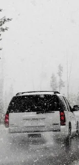 SUV driving through snowy winter forest road.