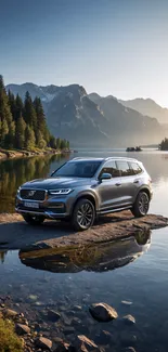 SUV parked by serene lake at sunset with mountain backdrop.