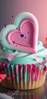 Cupcake with heart topper in pink and teal hues for phone wallpaper.