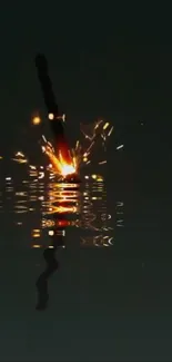 Sword with sparks reflected in dark water background.