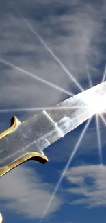 Sword shining against a bright blue sky and clouds.