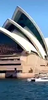 Sydney Opera House with blue sky and water in mobile wallpaper.