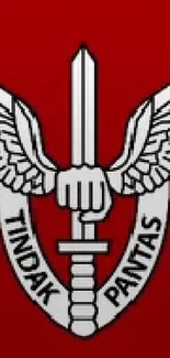 Tactical emblem with wings and sword on red.