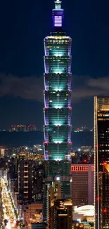 Taipei 101 illuminated at night, towering over city skyline.