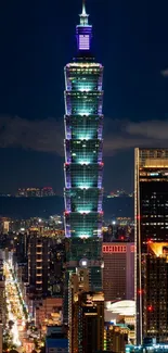 Night view of Taipei 101 tower with city lights.