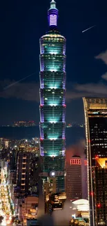 Night view of illuminated Taipei 101 with city skyline.