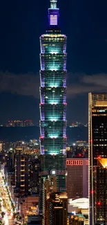 Taipei 101 glows brightly in nighttime cityscape.