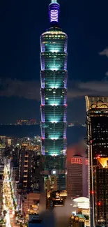 Taipei 101 illuminated with cityscape at night.