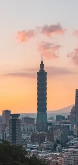 Taipei skyline at sunset with glowing peach skies and tall skyscrapers.