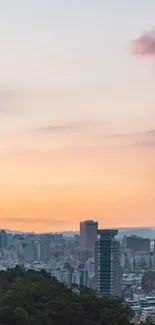 Taipei skyline at sunset with Taipei 101 towering over the city.