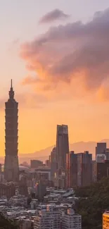 Taipei skyline at sunset with orange sky and modern buildings.