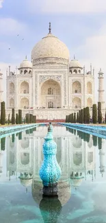 Taj Mahal with reflective pool under a clear sky mobile wallpaper.