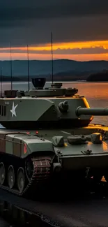 Military tank by a lake during sunset, creating a striking silhouette.