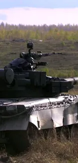 Tank in an open field with a scenic natural backdrop.