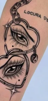 Tattoo of eyes within heart chains on skin background.