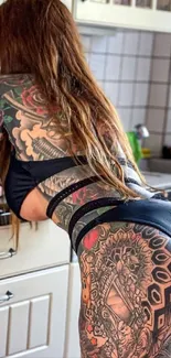 Vibrant tattoo art in contemporary kitchen setting.