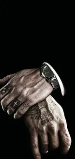 Tattooed hands with a watch on black background wallpaper.