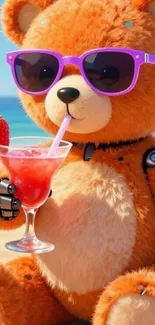 Teddy bear with sunglasses enjoying a drink on the beach.