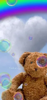 Teddy bear with heart cloud, rainbow and bubbles.