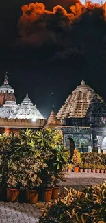 Historic temple under moonlit sky with lush plants.