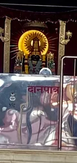 Intricate temple shrine with spiritual symbols and devotional elements.