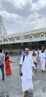 Group visiting a temple in traditional attire.