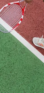 Tennis player on red and green court holding a racket.