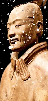 Terracotta warrior statue with snowflakes on a dark background.