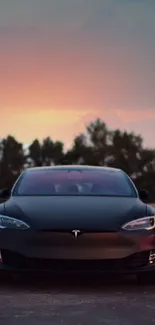 Tesla car at sunset with black exterior, in scenic view.