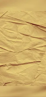 Wrinkled textured paper background in beige tones.