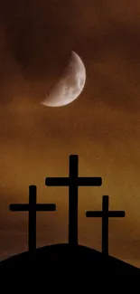 Three crosses on a hill with an orange sunset and a crescent moon.