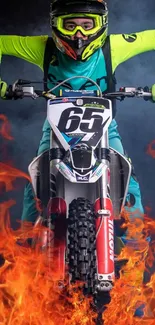 Motocross rider in vibrant flames, thrilling action.