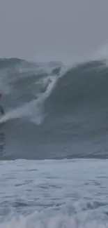 Surfer riding massive ocean waves in thrilling action scene.