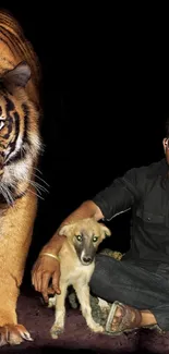 A man with a dog sits alongside a tiger on a black background.