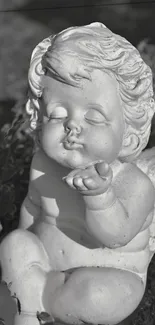 Grayscale angel statue with serene expression and intricate details.